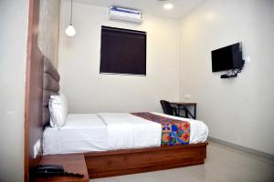 Postel nebo postele na pokoji v ubytování Hotel Pride Inn