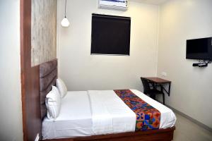 Postel nebo postele na pokoji v ubytování Hotel Pride Inn