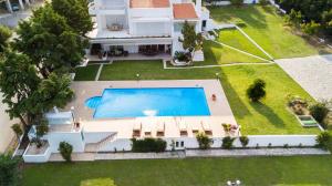 an aerial view of a house with a swimming pool at La Maison Blanche in Kavala