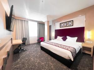Letto o letti in una camera di Batam City Hotel