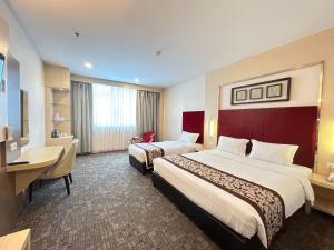 Letto o letti in una camera di Batam City Hotel