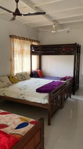 Postel nebo postele na pokoji v ubytování Shilpa Vikas Homestay