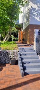 a set of concrete steps leading to a building at Apartamenty na Maciejową in Rabka-Zdroj