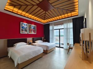 Postel nebo postele na pokoji v ubytování MonMonBoutique Hotel