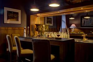 a bar in a restaurant with a table and chairs at Hacienda Peña Pobre in Mexico City