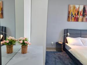 Krevet ili kreveti u jedinici u okviru objekta Seremban Pool View 5-6 pax Suite