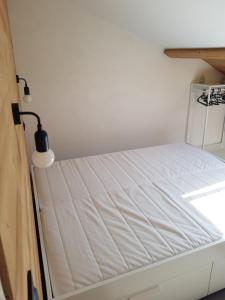 Una cama o camas en una habitación de Les biches du Soula 5 couchages proche piste ski