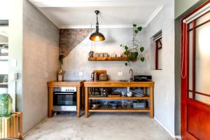 a kitchen with a wooden counter and a stove at Oak on Main in Hermanus +16 photos