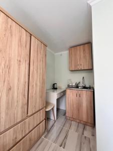 Kuchyň nebo kuchyňský kout v ubytování Cozy Haven + 37 fotografií