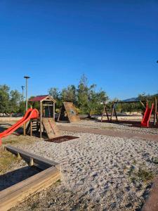 a group of playground equipment in a park at Apartment Lavanda in Starigrad