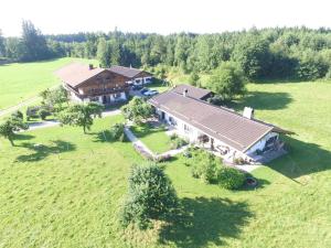 an aerial view of a large house in a field at Ferienparadies Fuchsloch in Waakirchen