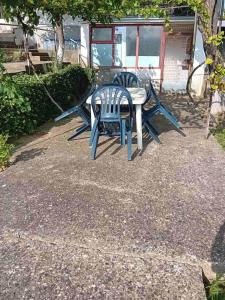 two chairs and a table in a yard at Gogovi Residence Dojran in Star Dojran