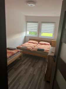 Posteľ alebo postele v izbe v ubytovaní W Apartmány 3 + 4 fotografie