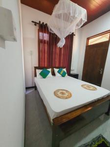 Postel nebo postele na pokoji v ubytování Sanu Home stay