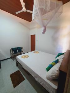 Postel nebo postele na pokoji v ubytování Sanu Home stay