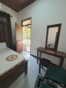 Postel nebo postele na pokoji v ubytování Sanu Home stay