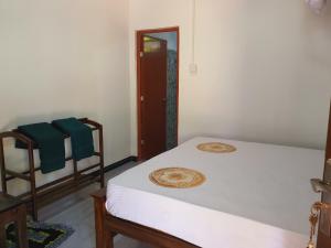 Postel nebo postele na pokoji v ubytování Sanu Home stay