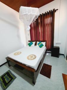 Postel nebo postele na pokoji v ubytování Sanu Home stay
