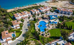 an aerial view of a resort with a swimming pool at Atlantis Gardens in Mazotos