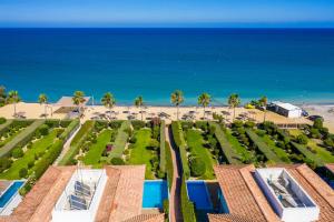 an aerial view of a resort with the beach at Atlantis Gardens in Mazotos