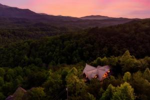 an aerial view of a house in the middle of a forest at Great Alpine - 4 KingSuites- December Deals-Views-Hot Tub-FirePit-GameRm in Gatlinburg