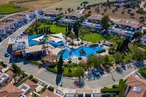 an aerial view of a resort with a pool at Atlantis Gardens in Mazotos