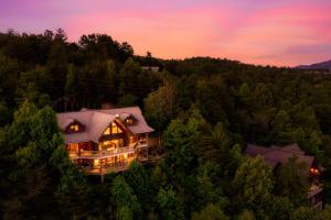 an aerial view of a house in the woods at Great Alpine - 4 KingSuites- December Deals-Views-Hot Tub-FirePit-GameRm in Gatlinburg
