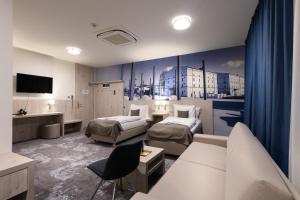 TV a/nebo společenská místnost v ubytování Košice Hotel