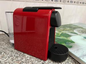 a red toaster sitting on top of a counter at Natalia's 1 Bedroom Apartemnt in Paphos