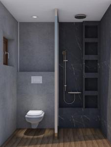 a bathroom with a toilet and a shower at Athos Villas in Ouranoupoli