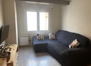 A seating area at Apartament Centre Platja