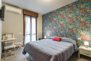 A bed or beds in a room at Residenza Il Fiore
