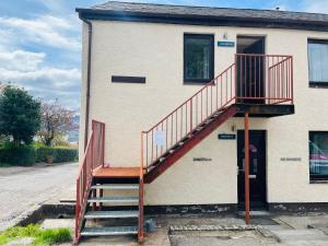 a staircase on the side of a building at Marina Apartments 2 in Fort William