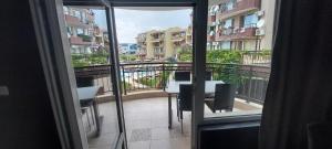 a view of a balcony with a table and chairs at Апартамент 4-6 човека in Sveti Vlas