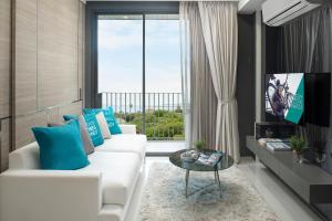 TV a/nebo společenská místnost v ubytování Cross Vibe Pattaya Seaphere