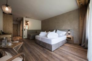 Giường trong phòng chung tại Hotel Patris