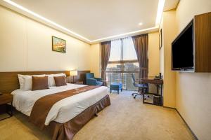 Gloucester Hotel Incheon客房内的一张或多张床位