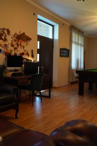 a living room with a desk and a pool table at Villa Aragvi in Mtskheta +45 photos