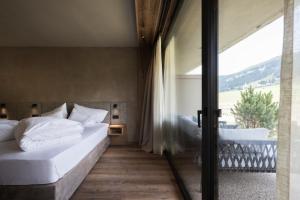 Giường trong phòng chung tại Hotel Patris