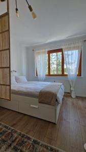 Postel nebo postele na pokoji v ubytování Cosy Apartment with a Magnificent View