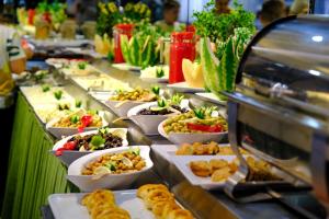 a buffet line with many plates of food at Grand Gülizar Otel in Sanlıurfa
