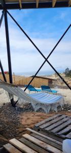 a view of a hammock on the beach at Casa AltaVista Guanaqueros in Guanaqueros
