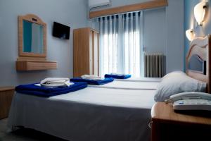 Posteľ alebo postele v izbe v ubytovaní Hôtel Argo