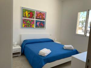 Postel nebo postele na pokoji v ubytování Agriturismo Le Paesane