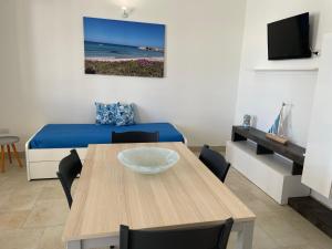 TV a/nebo společenská místnost v ubytování Agriturismo Le Paesane