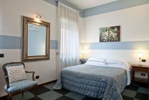 Ένα ή περισσότερα κρεβάτια σε δωμάτιο στο Boutique Hotel Scalzi - Adults Only