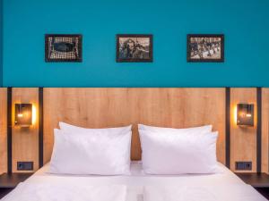 Postel nebo postele na pokoji v ubytování Mercure Hotel München Neuperlach Süd