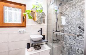 a bathroom with a sink and a shower at La Puerta Verde in Mataelpino +36 photos