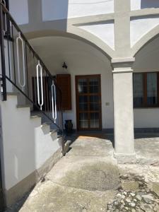 an entrance to a house with stairs and a door at Lacasadeitati in Lecco