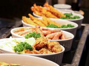 a bunch of dishes of food on a table at Dormy Inn Premium Shibuya-jingumae in Tokyo